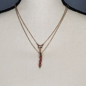 Necklace, gold toned with pink and clear beads